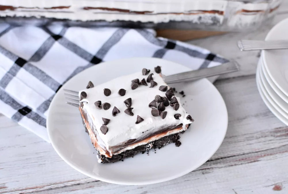 Chocolate Lasagna layer cake with whipped topping and chocolate chips on top